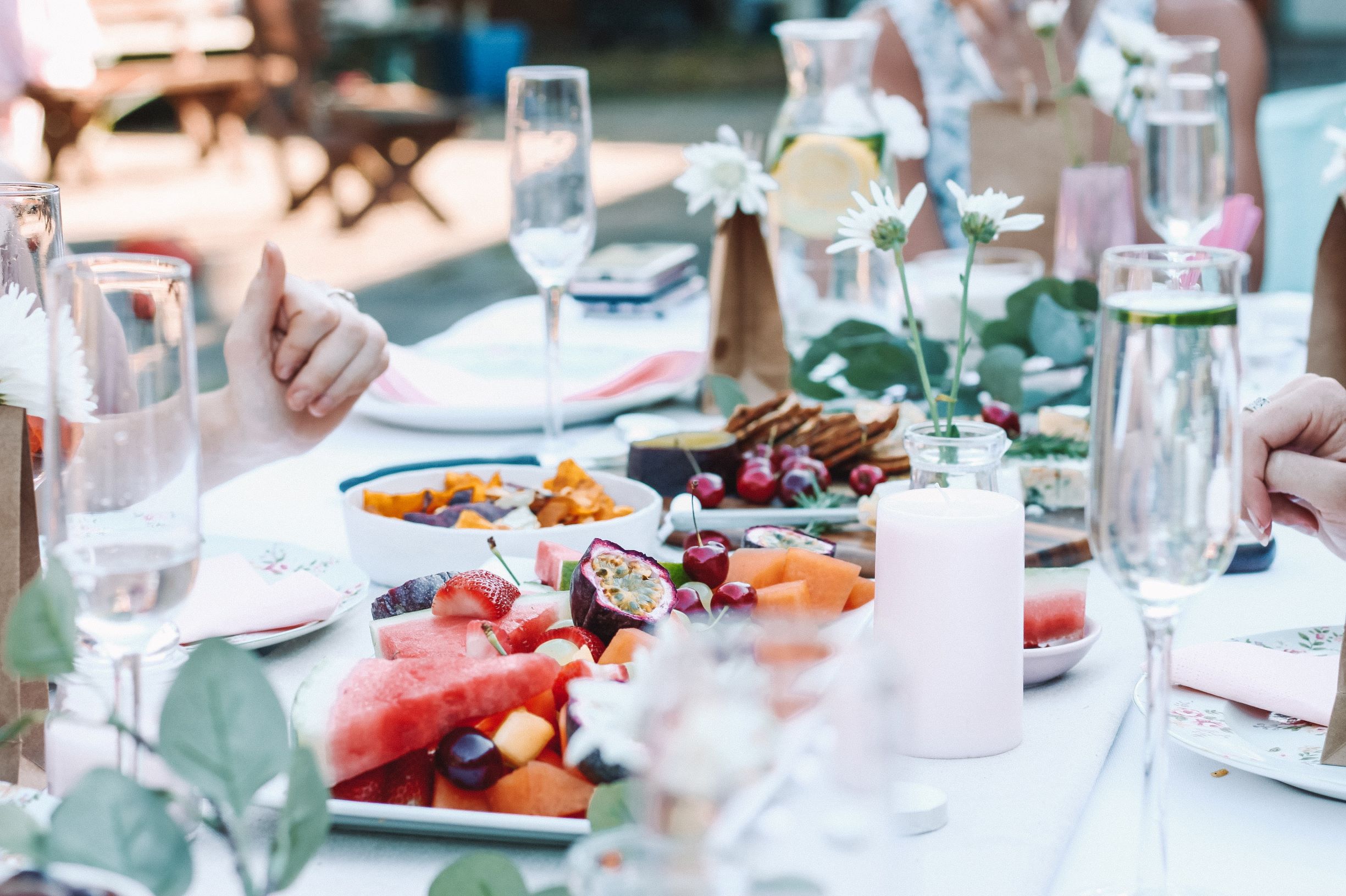 people eating at a table in summer