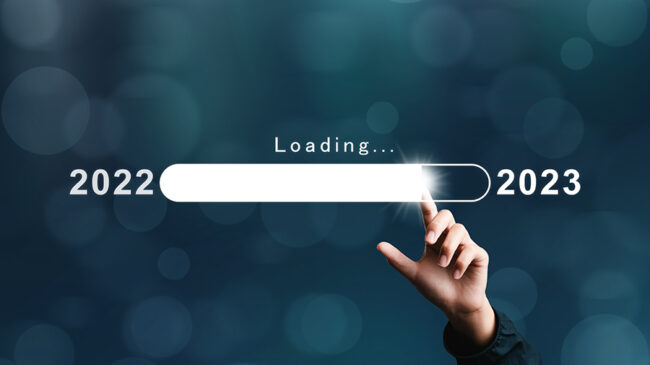 Businessman pointing bar numbers loading virtual new year 2023 t Businessman pointing bar numbers loading virtual new year 2023 to countdown from 2022 merry christmas arrangements. goal plan. goal concept. action plan, strategy, new year business vision