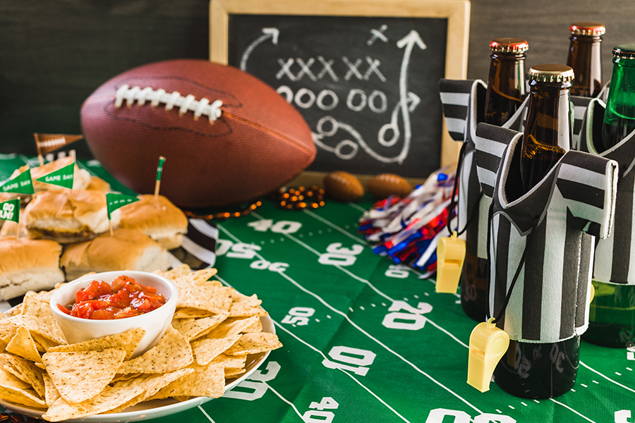Game day football party table with beer, chips and salsa.
