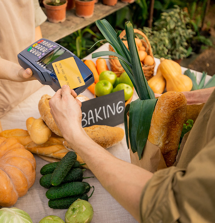 putting-credit-card-to-terminal-at-farmers-market-2023-11-27-05-30-07-utc Memorable Experiences with Streamlined Customer Management