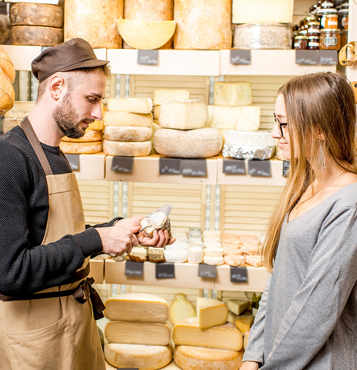 cheese-seller-with-a-customer
