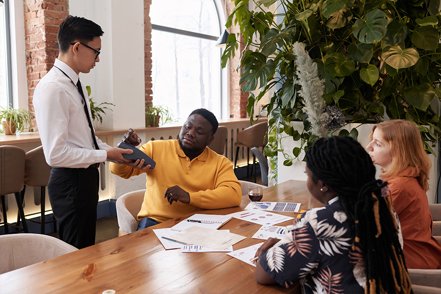 young-businessman-paying-for-lunch-in-restaurant