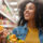 Excited person browsing a grocery aisle, shelves packed with vib